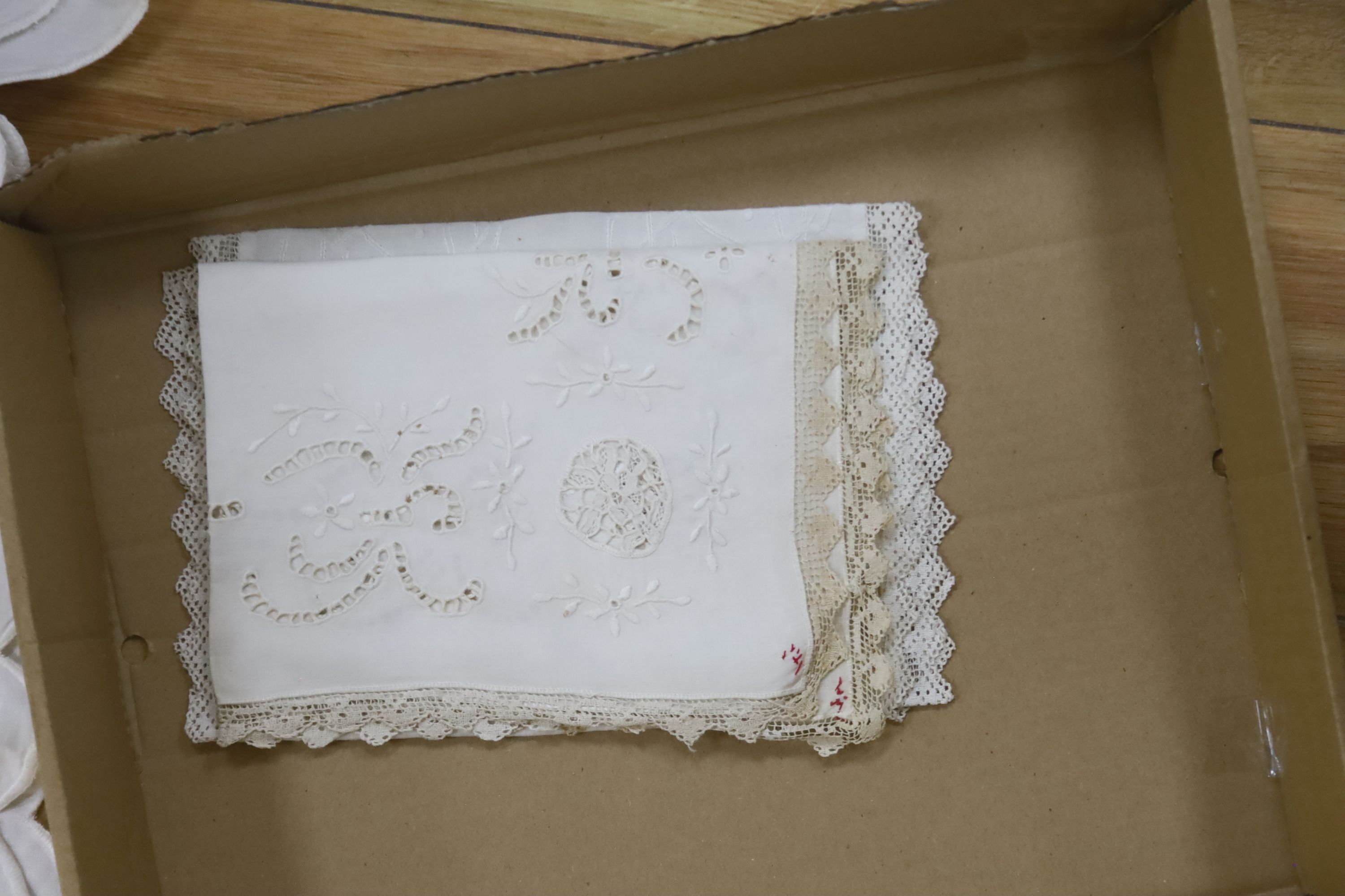 A black lace mantilla, filet and cutwork table cloth and a pair of 19th century silk jodhpurs